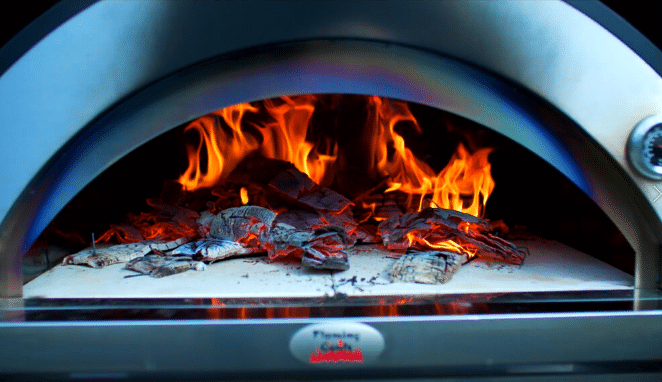 Mastering the Art of Cooking with a Pizza Oven Using Fire Underneath